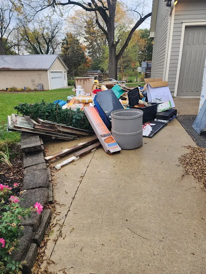 Dumpster being loaded with debris for Estate Cleanout Dumpster Rental in Oberlin